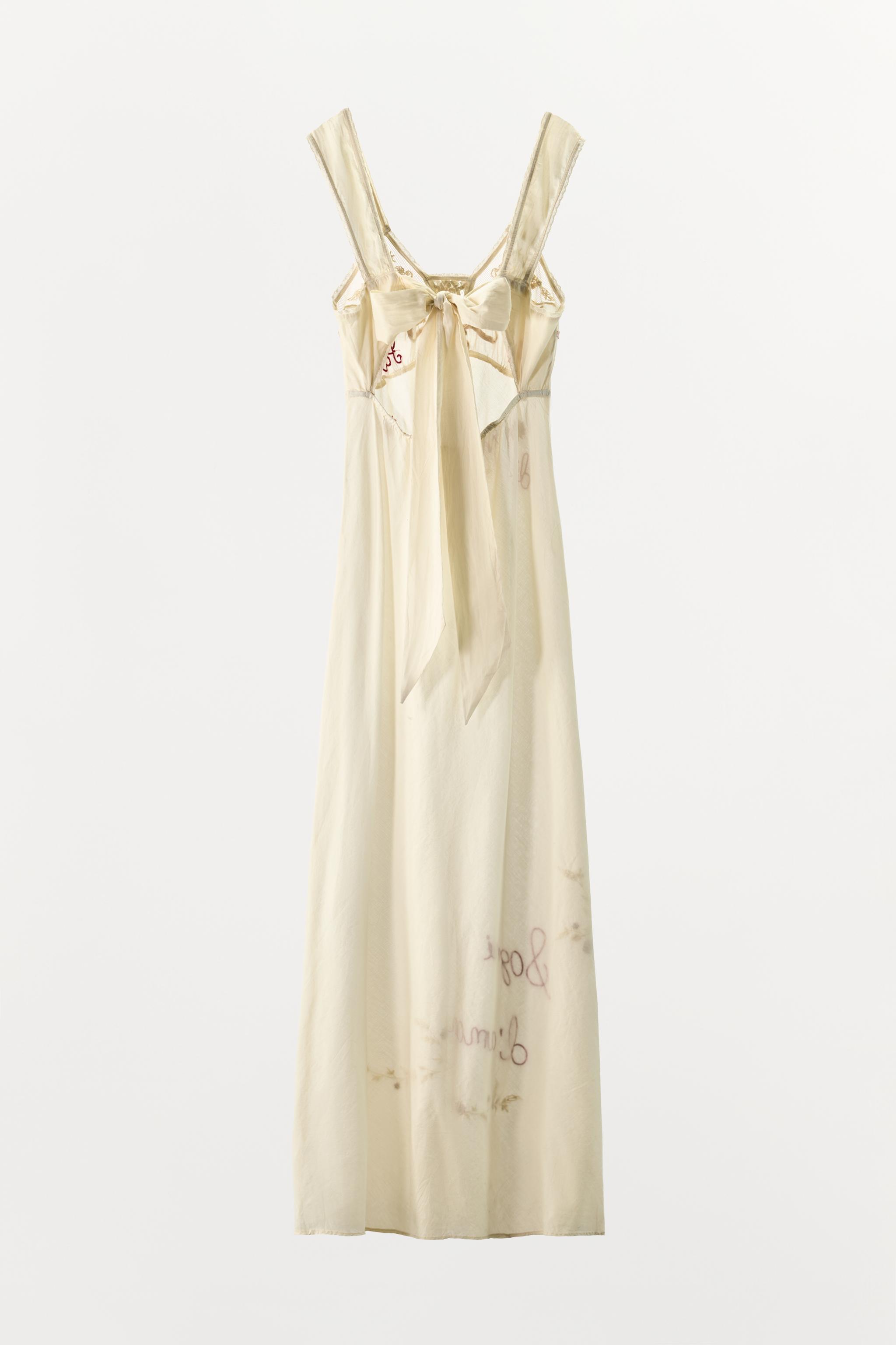 DRESS WITH EMBROIDERY, TEXT, AND BEADING